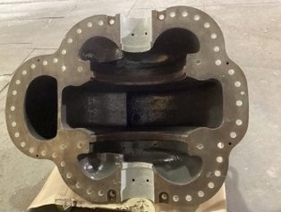 Top view of a fully refurbished pump casing for the oil and gas industry, featuring machined Ceramoclad 221 in the pump wheel seats and Säkatonit Extra AR on the interior surface