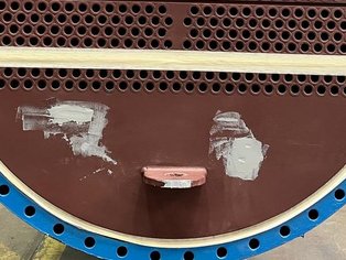 Tube Sheet of a Heat Exchanger with multiple mechanical damage being filled with Ceramoclad 221 prior to being overcoated with Si 57 EG/RE