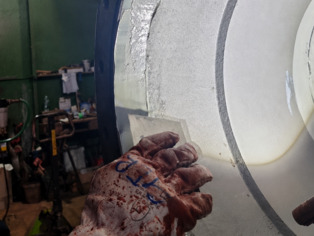 Ceramoclad 221 being trowelled smooth after application on a valve's deeply pitted surface areas