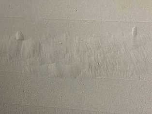 Blasted substrate with deep pitting, ground out prior to the application of TC Lining and Ceramoclad 221